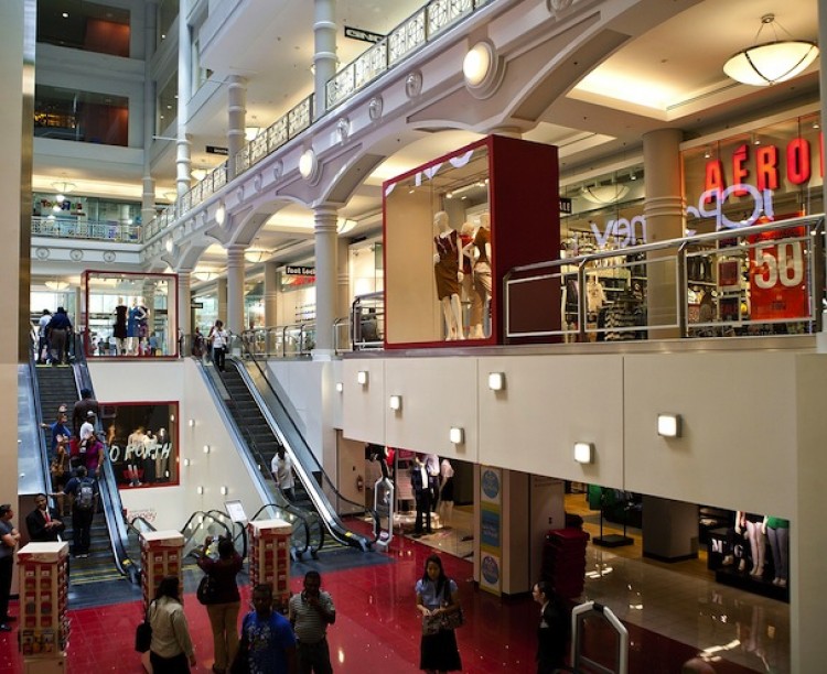 FRUGAL SHOPPERS: People shop at the Manhattan Mall on West 33rd Street on Aug. 2 in New York City. Consumer spending is on the decline, and every extra penny is being saved for rainy days. (Andrew Burton/Getty Images)