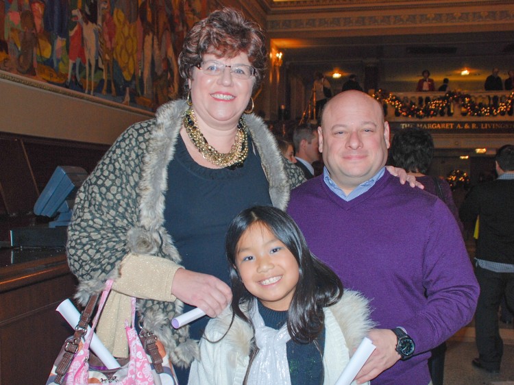 Mr. and Mrs. Carrillo with their adopted Chinese daughter