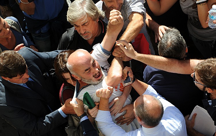 Members of the Indignados movement clash with police on Oct. 12, during a protest against the government in the center of Rome. (TIZIANA FABI/AFP/Getty Images)