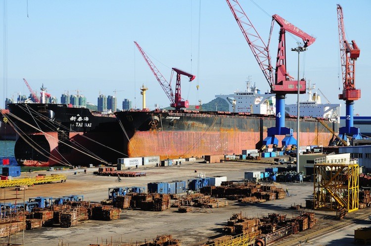 Cargo ships await loading in Qingdao Harbor, in northeast China's Shandong Province, Oct. 17. The U.S. trade deficit with China totaled $160 billion in the first half of 2011 alone. (STR/AFP/Getty Images)