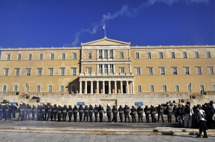 Police stand by the Greek parliament, at Athens Syntagma Square, on Oct. 19, 2011.  (Louisa Gouliamaki/AFP/Getty Images)