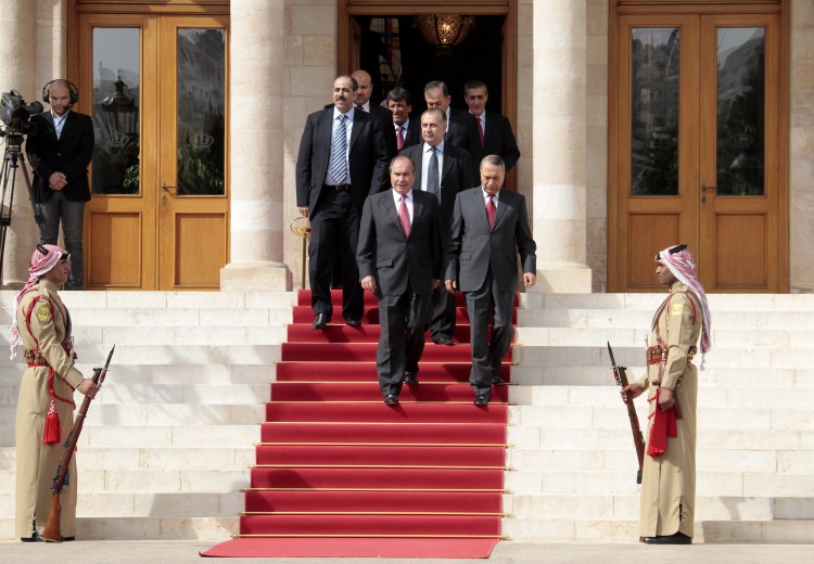 Jordan's outgoing prime minister Maruf Bakhit (front-R) and members of his former cabinet leave after their meeting with King Abdullah II at Raghadan Palace in Amman on October 24, 2011.  (Khalil Mazraawi/AFP/Getty Images)