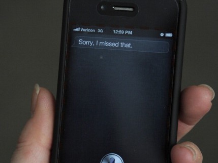 A woman tries to use the Siri voice-activated assistant software built into the Apple iPhone 4S March 13, 2012, in Washington, D.C. (Karen Bleier/AFP/Getty Images)