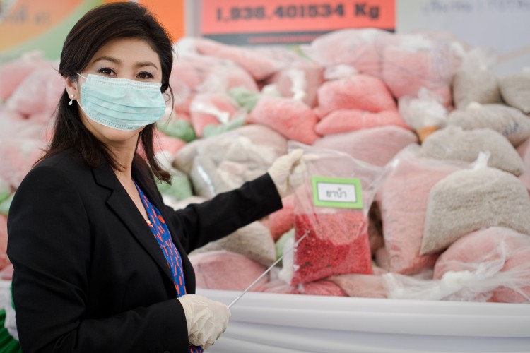 Thailand's Prime Minister Yingluck Shinawatra stands in front of bags of methamphetamine tablets in June 29, 2012.  (Nicolas Asfouri/AFP/GettyImages)