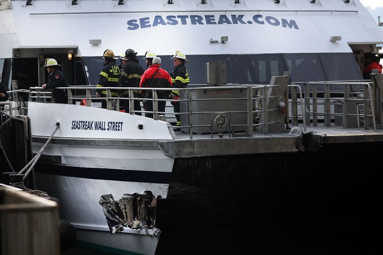 A gash in the Seastreak ferry is viewed following an early morning ferry accident during rush hour in Lower Manhattan on January 9, 2013 in New York City. About 50 people were injured in the accident, which left a large gash on the front side of the Seastreak ferry at Pier 11. (Spencer Platt/Getty Images)