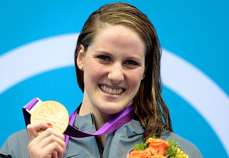 Missy Franklin of the United States celebrates with her gold medal during the medal ceremony for the Women's 100m Backstroke on Day 3 of the London 2012 Olympic Games. (Adam Pretty/Getty Images)