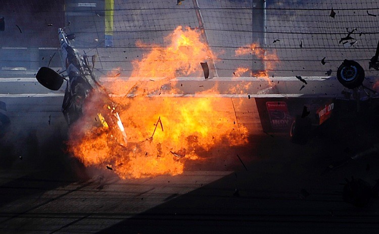 Dan Wheldon's car bursts into flames before slamming into the catch fence. Wheldon did not survive his injuries. (Robert Laberge/Getty Images)