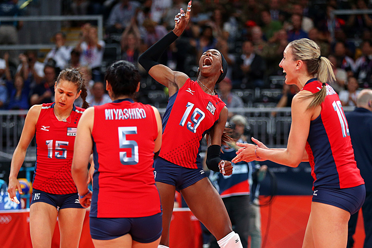 Destinee Hooker #19, Tamari Miyashiro #5, Logan Tom #15, and Jordan Larson #10 of United States celebrates after defeating Korea in the Women's Volleyball semifinal match on Day 13 of the London 2012 Olympics Games. (Elsa/Getty Images)