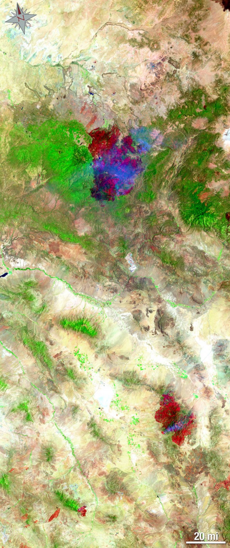 Both fires shown in the same image. (NASA/USGS, Mike Taylor)