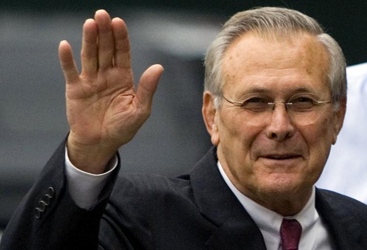 Secretary of Defense Donald Rumsfeld waves from outside the White House November 8, 2006 in Washington, DC.  (Brendan Smialowski/Getty Images)