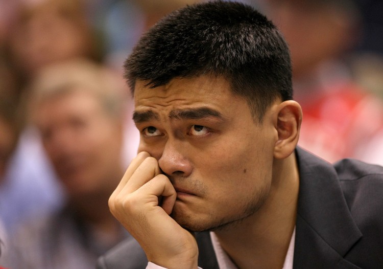 Yao Ming of the Houston Rockets sits injured on the bench during the 2008 NBA Playoffs. Ming announced his retirement from basketball on Wednesday due to prolonged injuries. (Jonathan Ferrey/Getty Images)