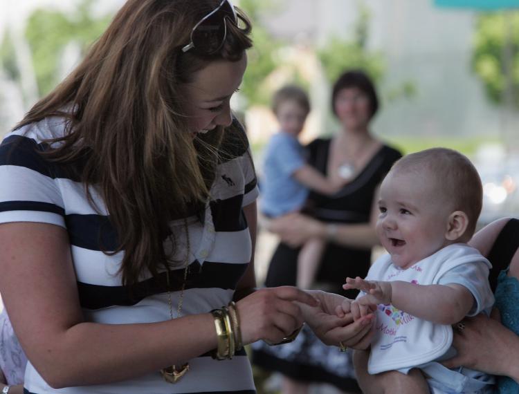 Welsh singer Charlotte Church meets other young mothers and their babies at a drive by the Welsh Assembly to encourage mothers to breastfeed in 2008 in Wales. (Photo by Matt Cardy/Getty Images)