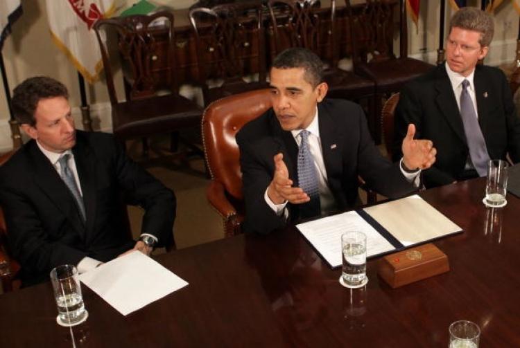 U.S. President Barack Obama is flanked by Treasury Secretary Timothy Geithner (L) and HUD Secretary Sean Donovan (R) as he speaks about the impact of historically low interest rates, at the White House April, 9 2009 in Washington DC. (Mark Wilson/Getty Images )