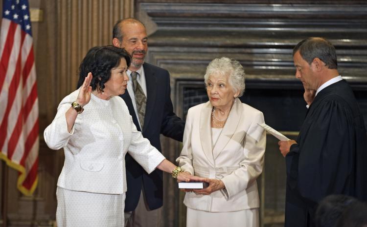 Judge Sonia Sotomayor (L) is sworn in with the Judicial Oath in the East Conference room of the Supreme Court on August 8.  (Paul J. Richards/AFP/Getty Images)