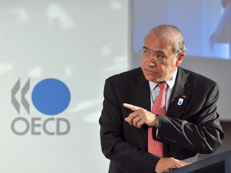 OECD Secretary-General Angel Gurria presents the new economic outlook on June 24, 2009 at the OECD headquarters in Paris.  (Eric Piermont/AFP/Getty Images)