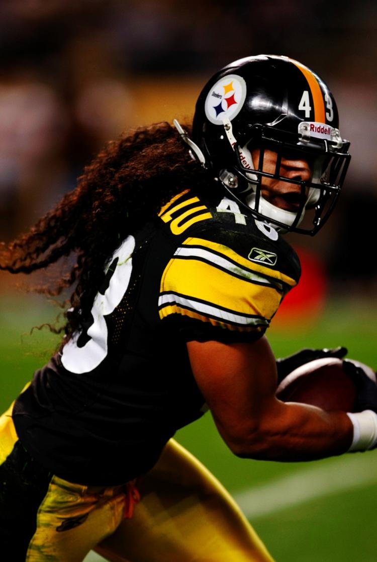 Troy Polamalu of the Pittsburgh Steelers runs with his signature hair flowing out of his helmet during a game against the Tennessee Titans at Heinz Field on Sept. 10, 2009 in Pittsburgh. (Scott Boehm/Getty Images)