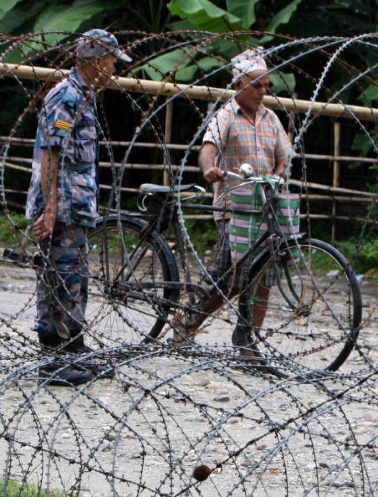 Nepalese police guard the entrance to The Beldangi II Refugee Camp some south-east of Kathmandu. (Prakash Mathema/AFP/Getty Images)