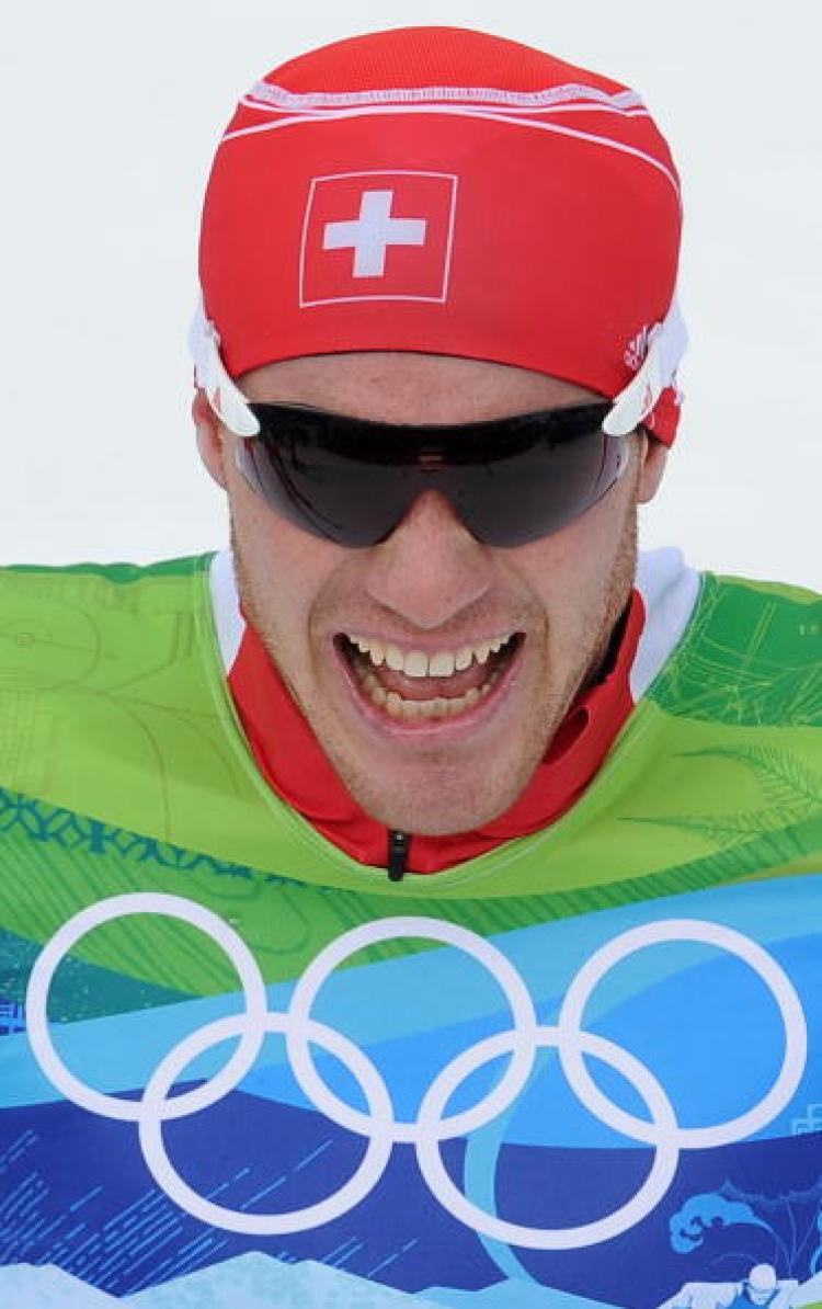 CHEER: Switzerland's Dario Cologna reacts after the men's 15-kilometer freestyle cross-country race at Whistler Olympic Park on Feb. 15, 2010 at the Vancouver Winter Olympics. (Alberto Pizzoli/AFP/Getty Images)