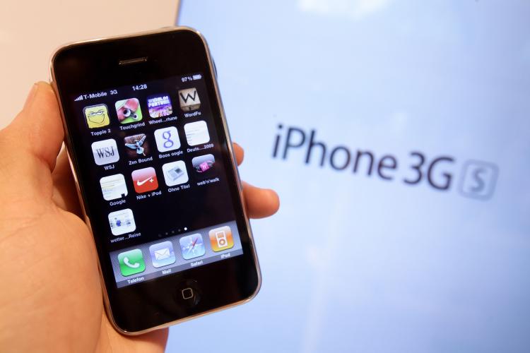 The photographer holds an iPhone at a shop of German telecommunications provider Deutsche Telekom on February 23, 2010 in Berlin, Germany. Deutsche Telekom is to present its financial results for 2009 on Feb. 25. (Sean Gallup/Getty Images)