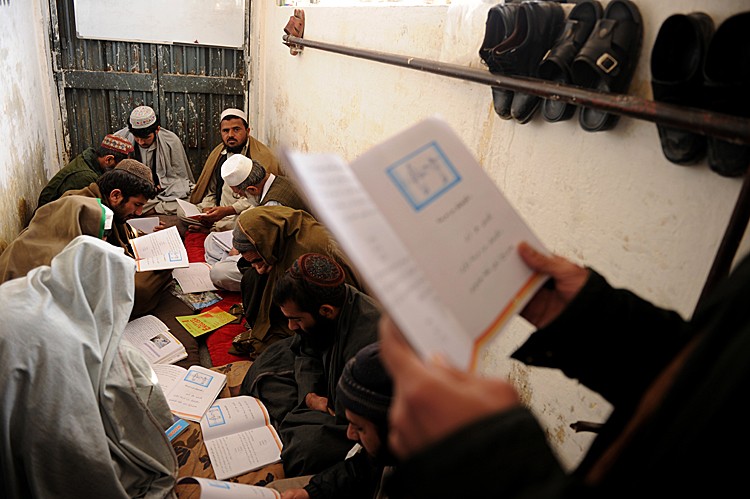 Afghan prisoners study the Pashto language at Pul-e Charkhi prison on the outskirts of Kabul on March 7, 2010. (Massoud Hossaini/AFP/Getty Images)