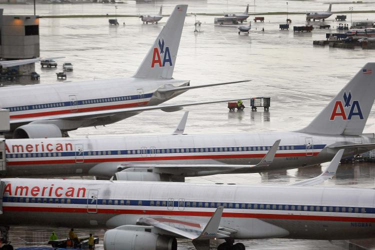 American Airlines parent company AMR Corp. has sued travel bookings website Orbitz Worldwide and its booking distribution company, in the latest development in an increasingly acrimonies row between airlines and travel booking sites. (Joe Raedle/Getty Images )