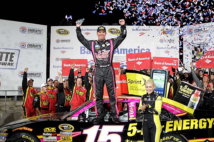 Clint Bowyer, driver of the No. 15 5-Hour Energy Benefiting Avon Foundation for Women Toyota, celebrates in Victory Lane after winning the NASCAR Sprint Cup Bank of America 500 at Charlotte Motor Speedway. (Jerry Markland/Getty Images for NASCAR)