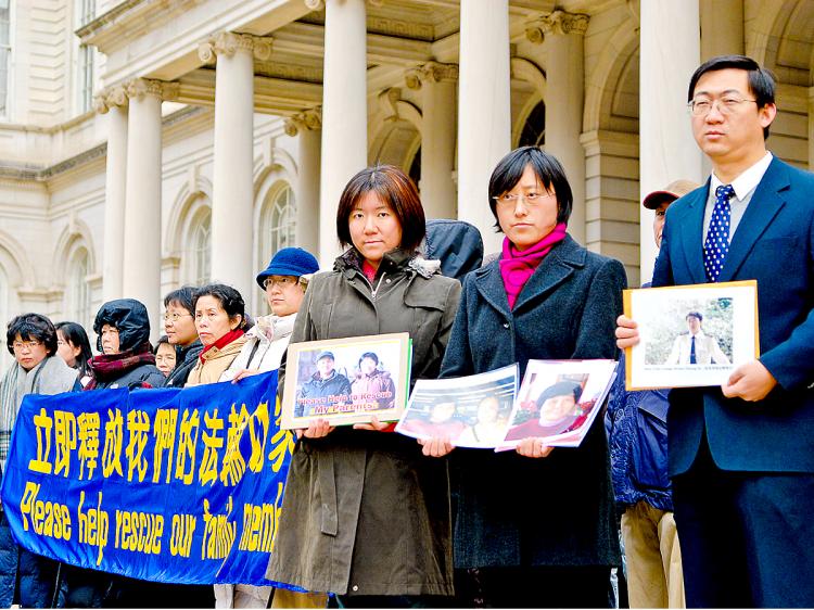 HUMAN RIGHTS: New York residents gather on the steps to City Hall to speak out against the persecution of their family members in China.  (Joshua Philipp/The Epoch Times)