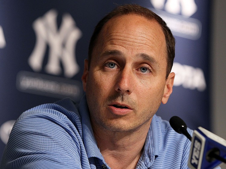 Brian Cashman will continue as GM of the Yankees. (Jim McIsaac/Getty Images)