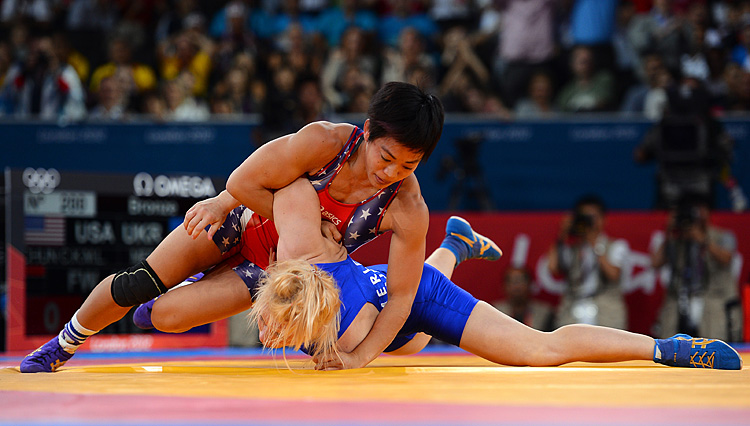 Clarissa Kyoko Mei Ling Chun of the United States (red) competes with Irini Merleni of Ukraine in the Women's Freestyle 48 kg Wrestling on Day 12 of the London 2012 Olympic Games. (Lars Baron/Getty Images)