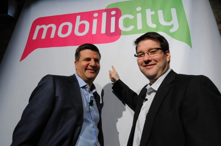 Chairman John Bitove (left) and President Dave Dobbin of Dave Wireless unveil Mobilicity, the name the new cellular phone provider will launch under at a press conference in Toronto on Tuesday.  (Photo courtesy of Mobilicity)