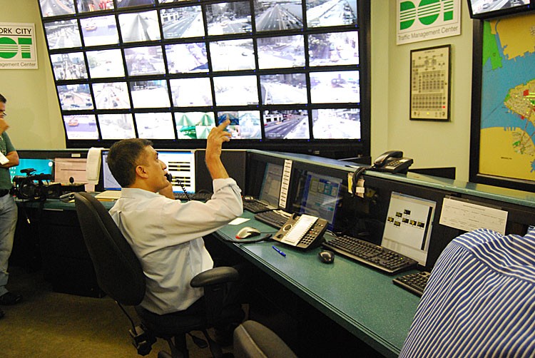 REMOTE ACCESS: An engineer at the Traffic Management Center in Long Island City, Queens, monitors real-time traffic in Midtown Manhattan on Monday. (Catherine Yang/The Epoch Times)