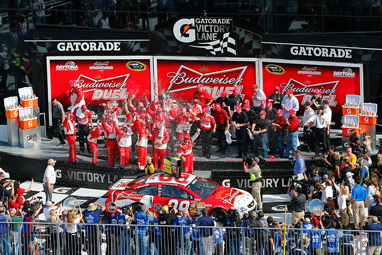 Kevin Harvick, driver of the #29 Budweiser Chevrolet, celebrates in Victory Lane after winning the NASCAR Sprint Cup Series Budweiser Duel 1 at Daytona International Speedway on February 21, 2013 in Daytona Beach, Florida. (Sam Greenwood/Getty Images)