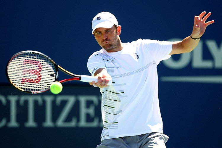 Mardy Fish returns the ball against Tobias Kamke during Day One of the 2011 US Open tennis tournament. (Julian Finney/Getty Images)