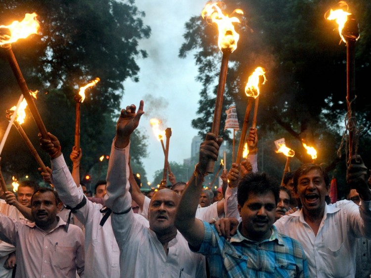 ANTI-CORRUPTION PROTEST: Activists from India's main opposition Bharatiya Janata Party (BJP) hold lighted torches and candles during a protest march in New Delhi on Aug. 16, against the arrest of Indian social activist Anna Hazare.  (Raveendran/AFP/Getty Image)