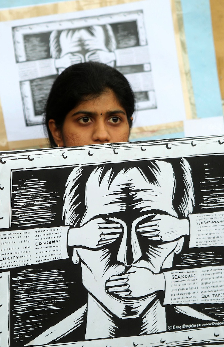 An activist holds a poster protesting the Indian Government's increasingly restrictive regulation of the Internet in Bangalore on June 9, 2012. (STRDEL/AFP/GettyImages) 