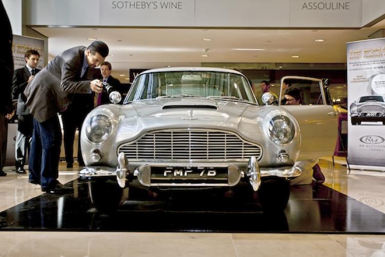 BOND, JAMES BOND: The Aston Martin DB5 used in bond films Thunderball and Goldfinger on display at Sotheby's New York. The famous movie car will be auctioned in London on Oct. 27. (Henry Lam/The Epoch Times)