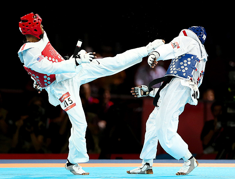 Terrence Jennings (L) of the United States delivers a final blow against Diogo Silva (R) of Brazil during the Men's-68kg Taekwondo bronze medal finals on Day 13 of the London 2012 Olympic Games. (Scott Heavey/Getty Images)