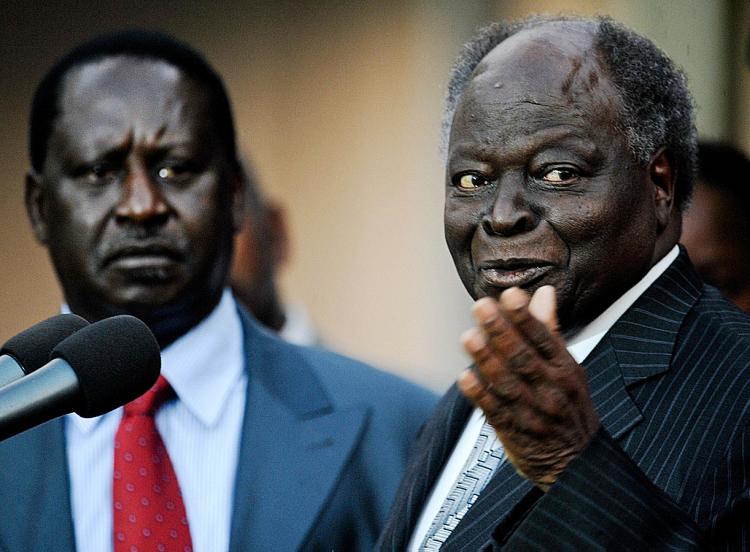 Kenyan President, Mwai Kibaki [R] alongside prime minister, Raila Odinga addresses the press on July 30, 2009, at the State House in Nairobi. (Tony Karumba/AFP/Getty Images)