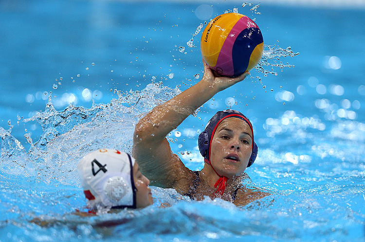 Kami Craig (R) prepares to shoot over China's Yujun Sun during their women's water polo match on Day 7 of the London 2012 Olympic Games. (Ezra Shaw/Getty Images)