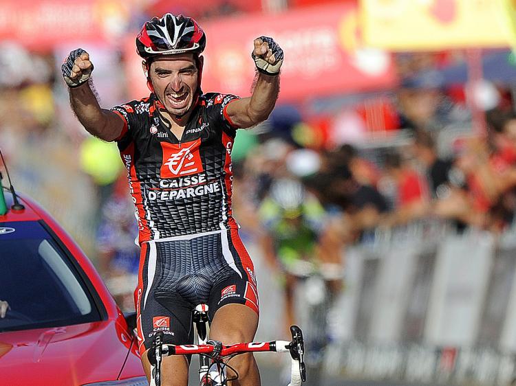 David Lopez of Caisse D'Epargne crosses the finish line to win Stage Nine of the 2010 Vueltas a Espana. (Jose Jordan/AFP/Getty Images)