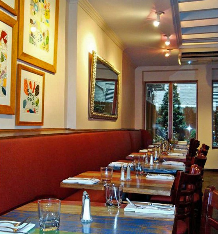 Multicolored tables add a special warmth at Madison Bistro. (Courtesy of Madison Bistro)