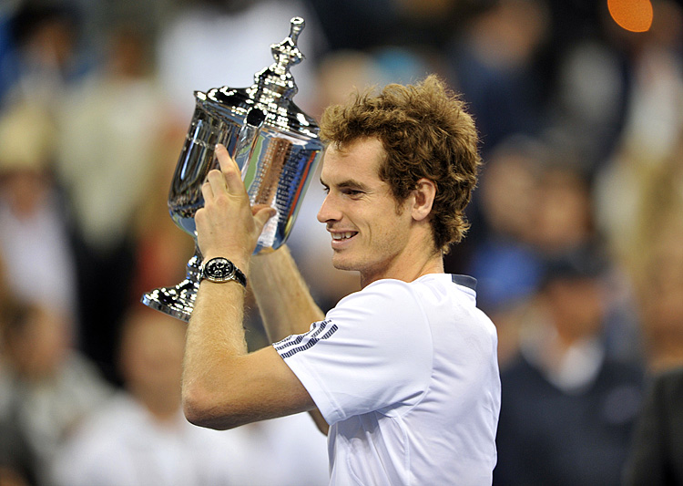 Andy Murray of Britain holds the trophy after his 7-6, 7-5, 2-6, 3-6, 6-2 win over Novak Djokovic of Serbia during their men's singles final match at the 2012 US Open tennis tournament. (Stan Honda/AFP/GettyImages)