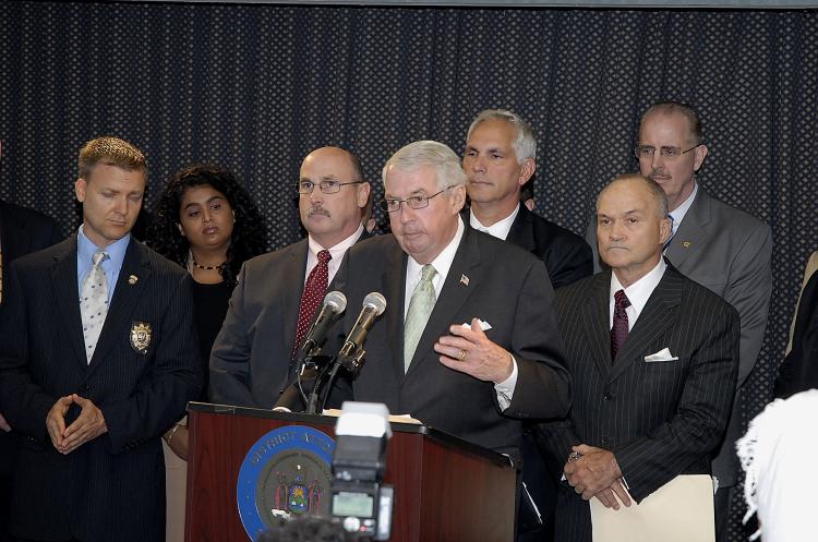 GANG INDICTMENT: Charles J. Hynes (Center at microphone) district attorney of Kings County speaking at a press conference on Wednesday. NYPD Commissioner Ray Kelly stands to his right.  (Jonah Bruno)