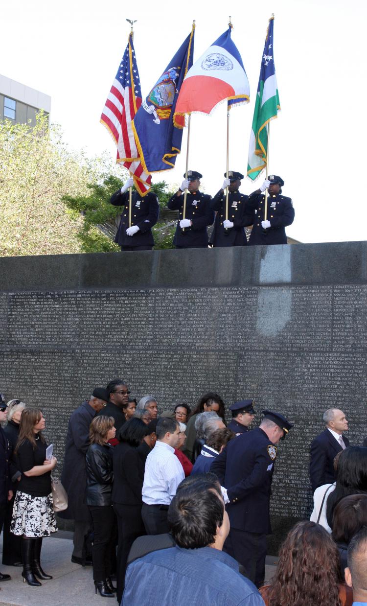 Families of the 12 NYPD officers who died in the past year gathered at the base of the Police Memorial in Battery Park. The monument is dedicated to NYPD officers fallen in the line of duty.  (Tara MacIsaac/The Epoch Times)