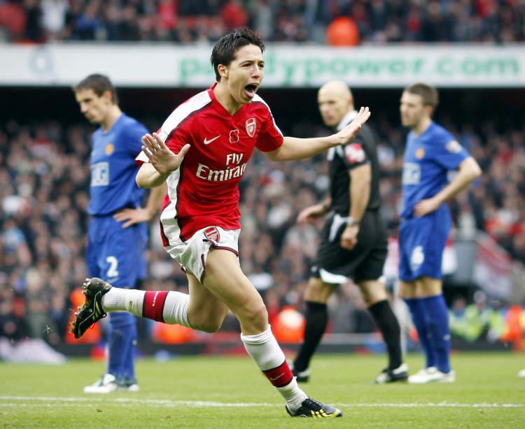 TWO-GOAL HERO: Samir Nasri celebrates after an incredible second goal following a classic Arsenal build up. (Adrian Dennis/AFP/Getty Images)