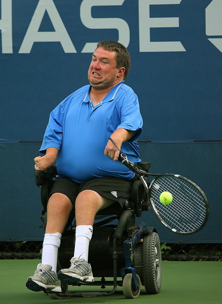 DETERMINATION: Nick Taylor returns a shot during the Men's Quad Singles Final on Thursday, September 8, 2011, at the US Open in Flushing, New York. Taylor did not win the singles title, but did manage to claim the doubles title with David Wagner on Saturday. (Gary Du/The Epoch Times)