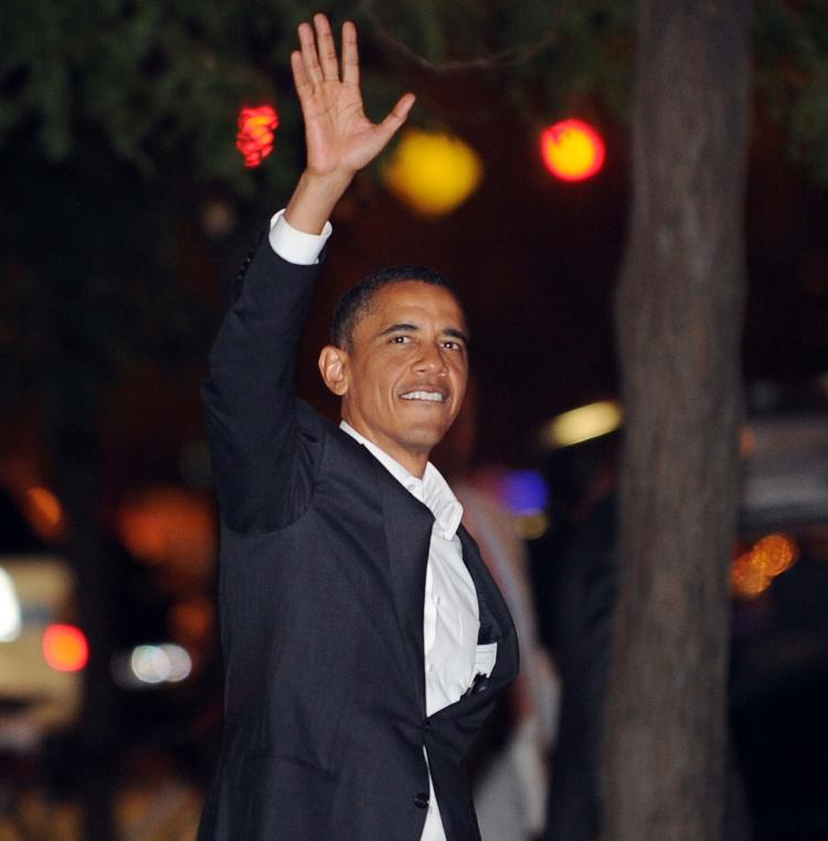 President Barack Obama waves to a crowd after dining at a local restaurant in Chicago on Aug.4. (Jewel Samad/AFP/Getty Images)