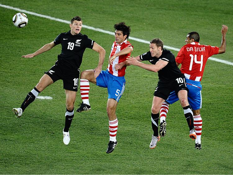 New Zealand's defender Tommy Smith (L) heads the ball past Paraguay's defender Julio Cesar Caceres (2ndL), New Zealand's striker Chris Killen (2ndR) and Paraguay's defender Paulo da Silva during their Group F first round 2010 World Cup match. (Jewel Samad/AFP/Getty Images)