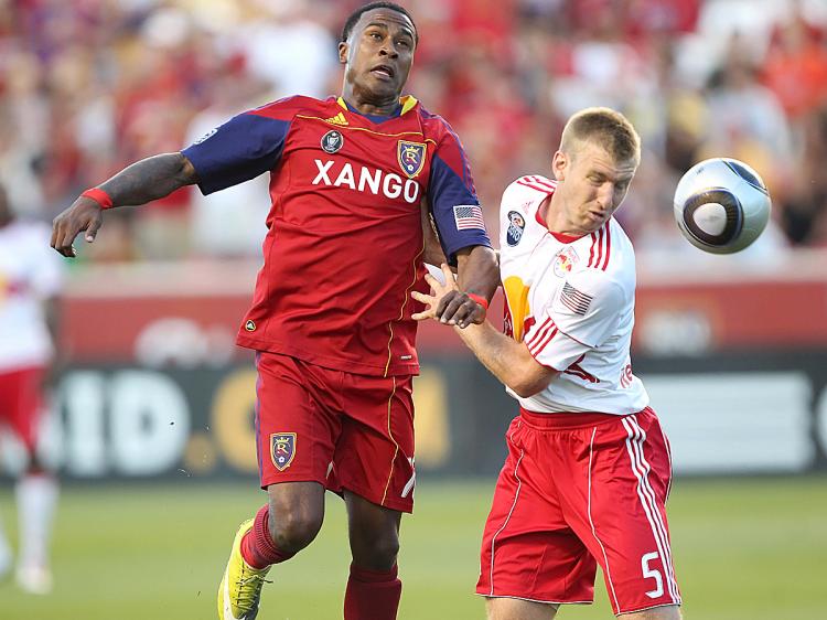 TIGHT BATTLE: Real Salt Lake's Robbie Findley (left) vies with New York's Tim Ream for the ball on Saturday. (George Frey/Getty Images)