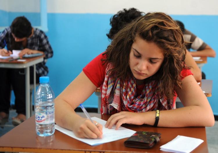 A student taking her high school exam. The Florida Comprehensive Assessment Test (FCAT) results were released on Tuesday, revealing an increase in performance in middle school and high school students.  (Fethi Belaid/Getty Images)